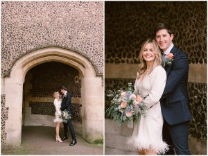 Oliver & Abigail against the cobblestone wall after their Intimate Wedding at Winchester Registry Office