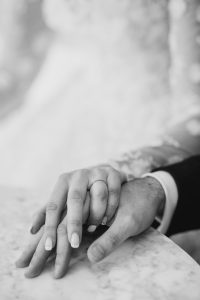 Hampshire Wedding Photographer Lucylou Photography- Close up shot of couple holding hands