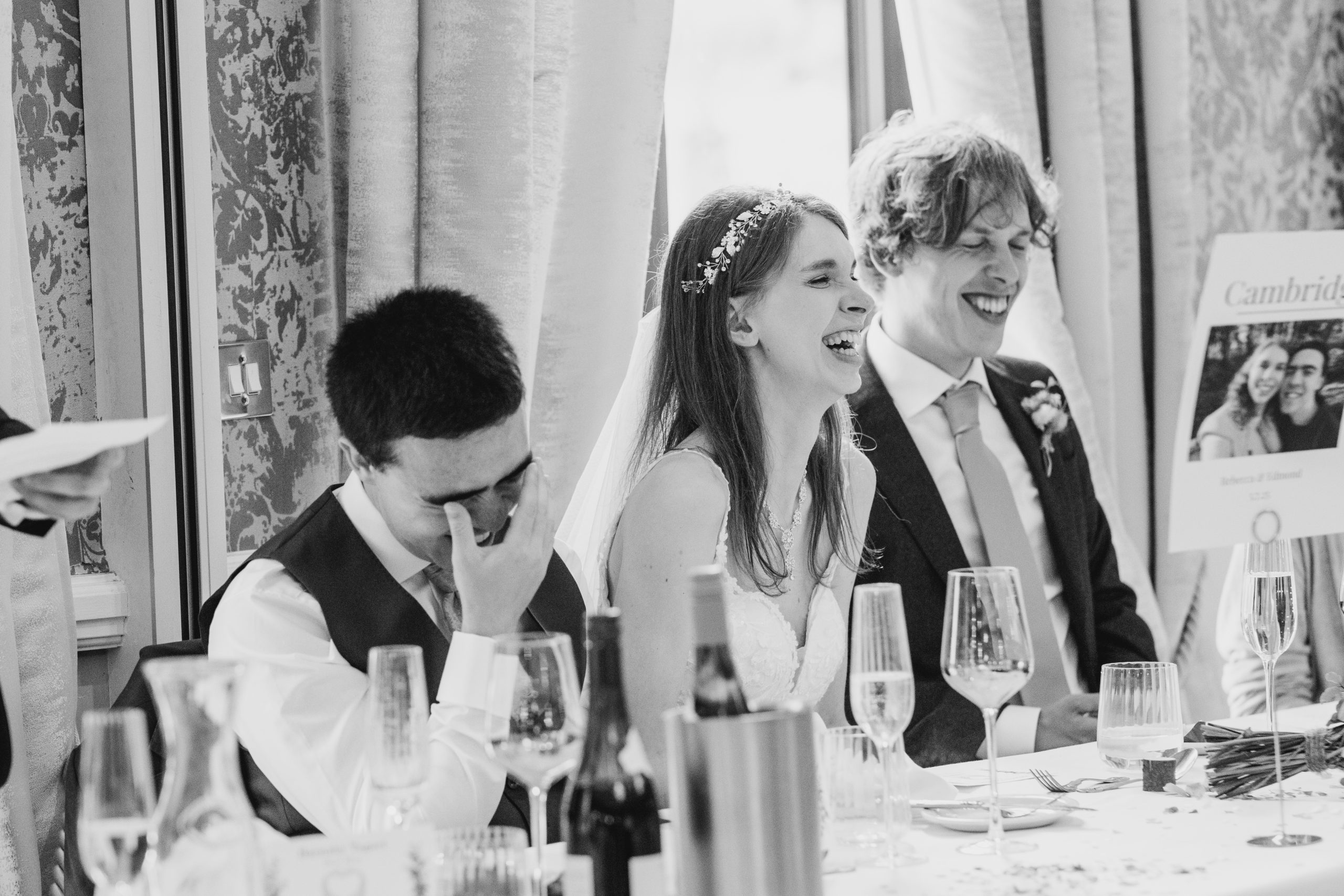 groom during his head in his hand with embarrassment during best man's speech